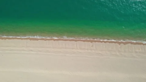 Abstract aerial track looking down at shoreline, Chesil beach Video stock 229007726