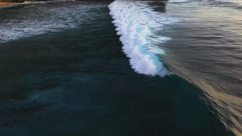 Abstract aerial view of ocean waves crashing on rocky shoreline Stock Footage 109483530