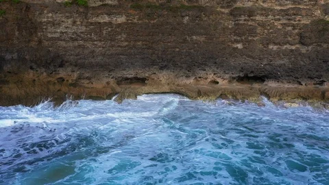 Abstract aerial view of ocean waves crashing on rocky shoreline Stock-Footage 109485489