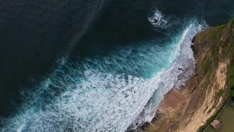 Abstract aerial view of ocean waves crashing on rocky shoreline Stock-Footage 109535487