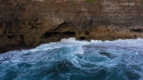 Abstract aerial view of ocean waves crashing on rocky shoreline Stock-Footage 109539118