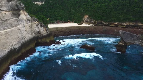Abstract aerial view of ocean waves crashing on rocky shoreline Stock Footage 111722637