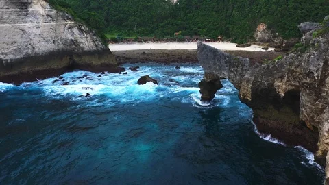 Abstract aerial view of ocean waves crashing on rocky shoreline Stock Footage 111722743