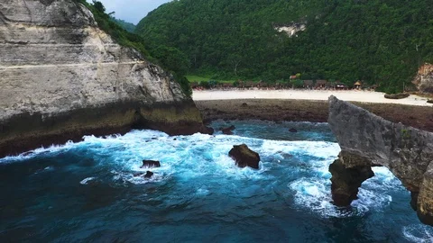 Abstract aerial view of ocean waves crashing on rocky shoreline. Stock Footage 111798163