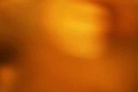 Abstract Amber Hues Soft Gradient Background with Blurred Texture Stockfoto's