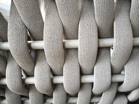 An abstract and textured pattern of interwoven wide, thick ribbons Stock Photos