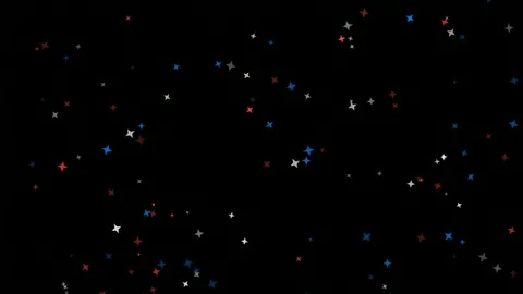 Abstract animation of red white and blue sparkling stars floating on a black Video stock 345429837