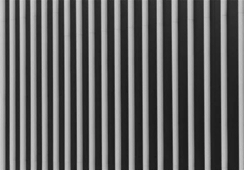 Abstract architectural columns create striped pattern with light and shadow. Stock Photos