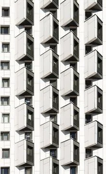 Abstract architectural pattern of repetitive volumetric balcony boxes on mo.. Stock Photos