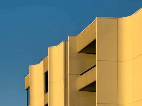 Abstract Architectural Study of a Modern Building's Curved Facade and Balco.. Stock Photos