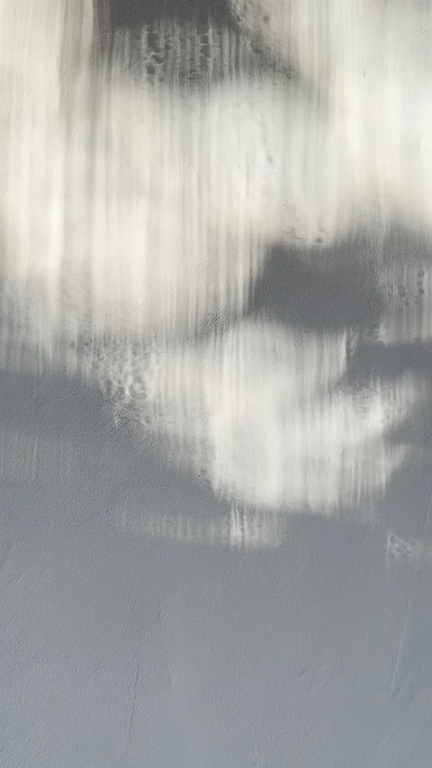 Abstract architectural wall texture featuring dramatic interplay of soft natural 스톡 동영상 333569063