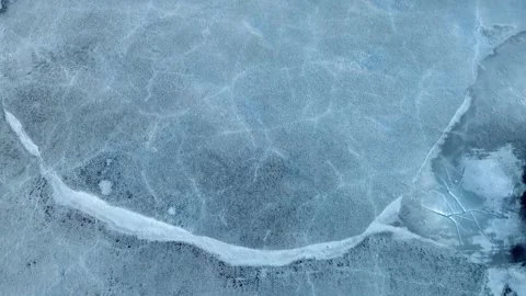Abstract Arctic Textures: High-Angle Drone View of Fractured Ice Stock Footage 337141826