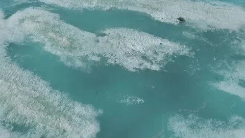 Abstract Arctic Textures: Top-Down View of Melting Ice Floes Stock Footage 336814793