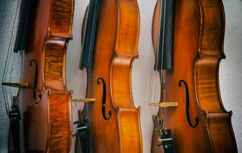 The abstract art design background of three violins stacked on background.sho 写真素材