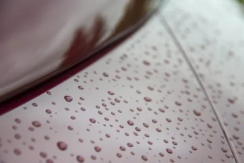 Abstract art texture background of raindrops on red metal Stock Photos