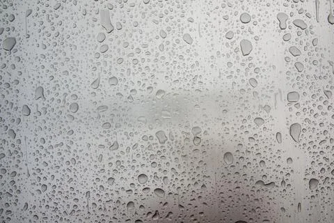 Abstract art texture background of raindrops on steel of old retro car Stock Photos