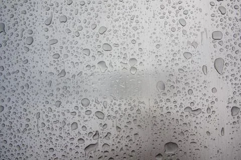 Abstract art texture background of raindrops on steel of old retro car Stock Photos