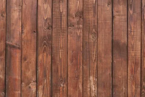 Abstract artistic background: plain brown wooden wall. Stock Photos