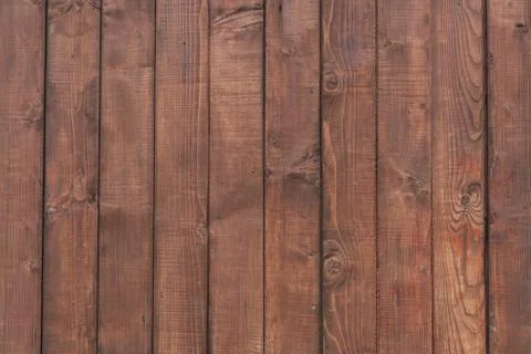 Abstract artistic background: plain brown wooden wall. Stock Photos