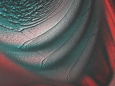Abstract artwork featuring swirling patterns and textures in shades of red .. Stock Illustration