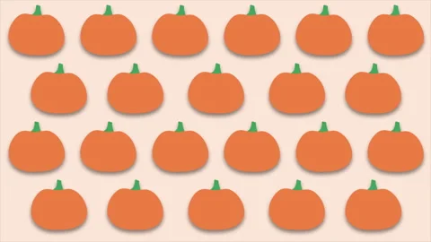 Abstract autumn background of cute pumpkins swaying on light peach backdrop. Stock Footage 304171030