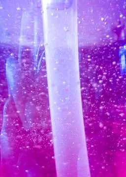 Abstract background with air bubbles within purple-orange dish soap liquid Stock Photos