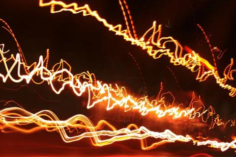 Abstract background and texture of traced glowing lines of lights.. Stock Photos