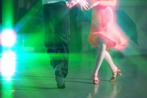 Abstract background of ballroom dancing in the rays of stage lighting. The .. Stock Photos