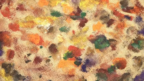 Abstract background on beige burlap fabric formed by paint brushes and paints Stock Footage 333568702