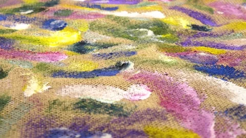 Abstract background on beige burlap fabric formed by paint brushes and paints Stock Footage 333568803