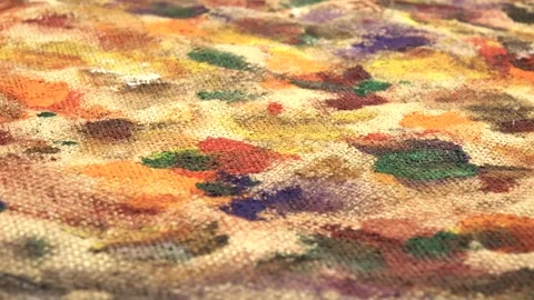 Abstract background on beige burlap fabric formed by paint brushes and paints Stock Footage 333568814