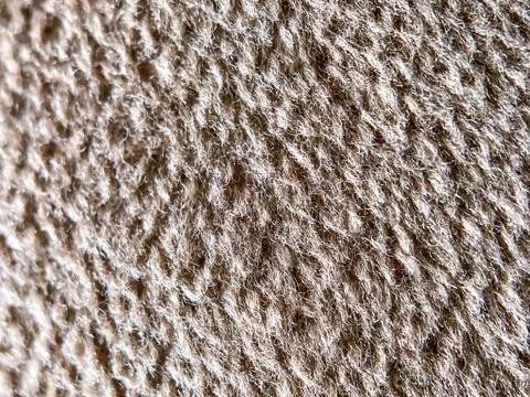 Abstract background of a beige fleecy surface Stock-Fotos