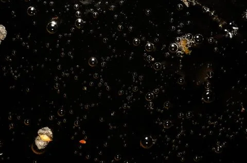 Abstract background - black water surface with bubbles Stock Photos