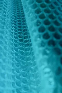 Abstract Background With Blue Cells On Folded Mesh Structure Fotos de archivo