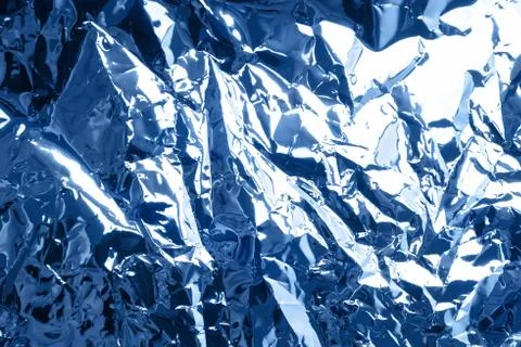 Abstract background. Blue foil texture. Stock Photos