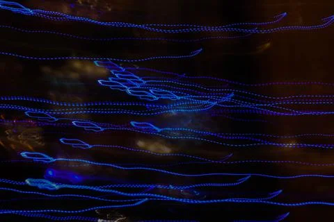 Abstract background of blue lights made with long shutter speed. Stock Photos