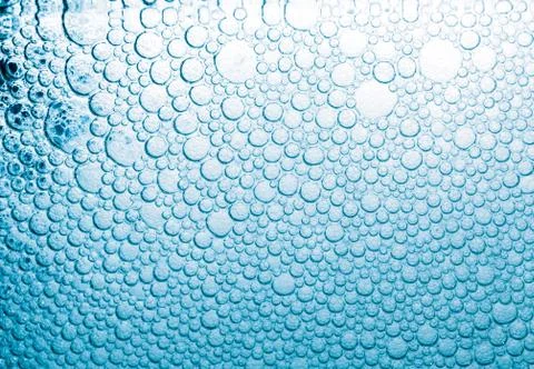 Abstract background of blue soap bubbles. Concept of cleansing Stock Photos
