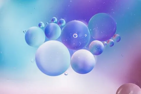 Abstract background in blue violet tones. Distortion in water with oil drops. Illustrazione stock