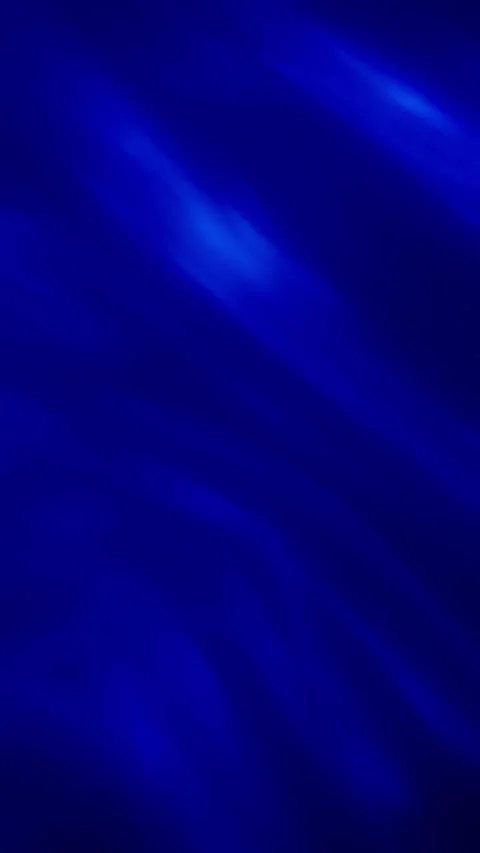 Abstract background of blue wavy soft pattern. Slow motion. Vertical Format Stock Footage 319803194