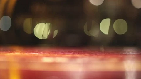 Abstract background blurred bokeh flare night lights in cafe window wooden table Stock Footage 76563699