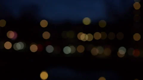 Abstract background of blurred car headlights at night with soft bokeh lights Stock Footage 321537574