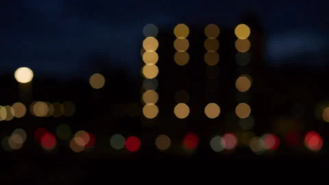 Abstract background of blurred car headlights at night with soft bokeh lights Stock Footage 321647867