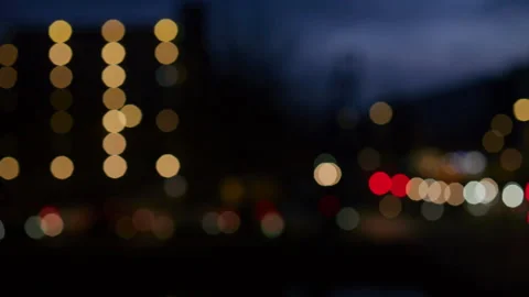 Abstract background of blurred car headlights at night with soft bokeh lights Stock Footage 321648025