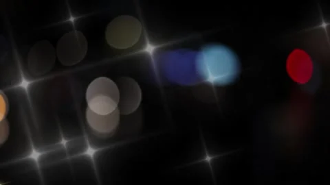 Abstract background of blurred city lights at night with a sparkling star Stock Footage 337465705