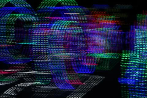 Abstract background of blurred dotted lines on dark background. Stock Photos