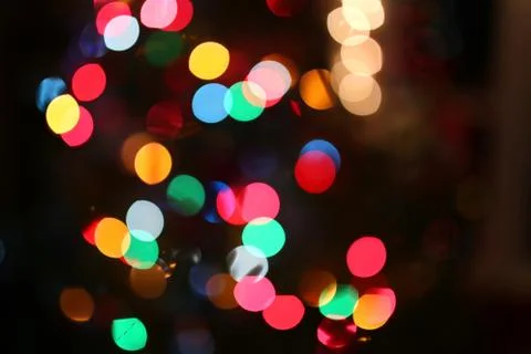 Abstract Background of Blurred Rainbow Colored Christmas Tree Lights Stock Photos