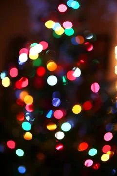 Abstract Background of Blurred Rainbow Colored Christmas Tree Lights Stock Photos