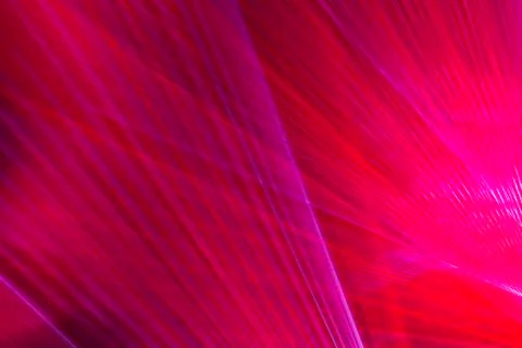 Abstract background with blurred ray of red light. Lighting and spotlights li Stock Photos