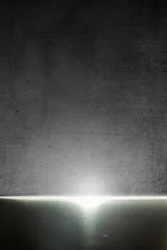Abstract background with a bright beam of light shining from a gap between .. Foto stock