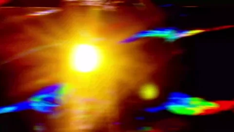 Abstract background with a bright glowing sunlike light source and colorful.. Stock Footage 346559596